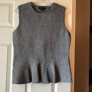 Heavy, definitely stretchy and keeps its shape